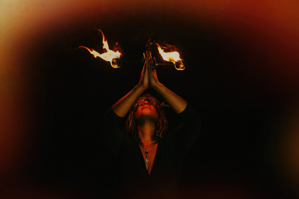 Angela of GlassWing Medicine with Palm torches for the Leo New Moon July 2025