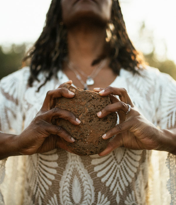 Angela holding a rock in Sedona Simply Aligned Coaching GlassWing Medicine