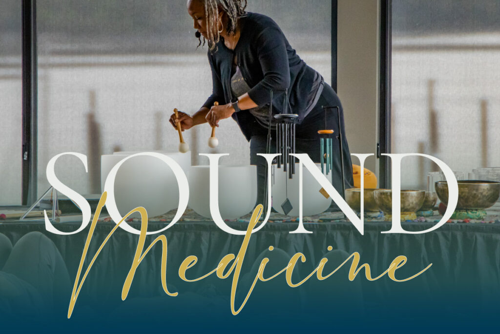 Photo of a black woman playing crystal bowls for a sound healing training for GlassWing Medicine